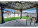 Outdoor patio area featuring a covered gazebo with stylish seating at 601 Panola Ln., Myrtle Beach, SC 29588