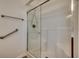 Bright bathroom showcasing a glass-enclosed shower with convenient grab bars at 601 Panola Ln., Myrtle Beach, SC 29588