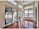 Bright sunroom featuring high ceilings, sliding glass doors, and hardwood floors at 601 Panola Ln., Myrtle Beach, SC 29588