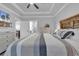 This bedroom features a TV, tray ceiling, and a wood headboard at 6013 Tramonto St., Myrtle Beach, SC 29577