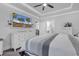 This bedroom features a TV, tray ceiling, and is furnished with white dressers at 6013 Tramonto St., Myrtle Beach, SC 29577