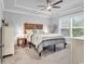 Bright bedroom features a tray ceiling, ceiling fan and a large window for natural light at 6013 Tramonto St., Myrtle Beach, SC 29577