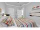Serene bedroom features decorative oars, comfortable bed, and plenty of natural light at 6013 Tramonto St., Myrtle Beach, SC 29577