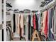 Walk-in closet with wire shelving and hanging rods filled with neatly organized clothing at 6013 Tramonto St., Myrtle Beach, SC 29577
