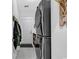 Functional laundry room with modern washer and dryer, storage cabinets, and hanging rack at 6013 Tramonto St., Myrtle Beach, SC 29577