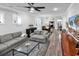 Open concept living room and dining area with wood floors and an area rug at 6013 Tramonto St., Myrtle Beach, SC 29577