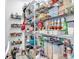 Organized walk-in pantry with metal shelving stocked with canned goods, dry goods, and storage containers at 6013 Tramonto St., Myrtle Beach, SC 29577