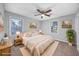 Staged primary bedroom offers a calm color palette and large windows at 602 Luttie Rd., Myrtle Beach, SC 29588