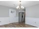 Inviting dining room featuring vinyl floors, fresh paint, and access to the kitchen at 602 Luttie Rd., Myrtle Beach, SC 29588