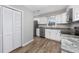 Bright kitchen with white cabinets, stainless appliances, and granite countertops at 602 Luttie Rd., Myrtle Beach, SC 29588