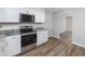 Modern kitchen featuring stainless steel appliances and stone countertops at 602 Luttie Rd., Myrtle Beach, SC 29588