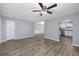 Bright empty living room with a ceiling fan flowing into the dining room and kitchen at 602 Luttie Rd., Myrtle Beach, SC 29588