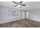Bright empty living room with a ceiling fan and a bay window at 602 Luttie Rd., Myrtle Beach, SC 29588