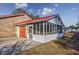 Attached screened porch next to a garage with a red door at 602 Luttie Rd., Myrtle Beach, SC 29588