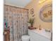 Bright bathroom with a shower, vanity, and seashell-themed decor for a beach-inspired feel at 609 Hillside Dr. S. # E-18, North Myrtle Beach, SC 29582