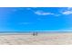 Wide sandy beach with ocean views and beach chairs at 609 Hillside Dr. S. # E-18, North Myrtle Beach, SC 29582
