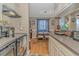 Cozy kitchen leading to a dining area, complemented by hardwood floors and nautical accents at 609 Hillside Dr. S. # E-18, North Myrtle Beach, SC 29582