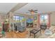 Bright living room with hardwood floors, slider to balcony, and fireplace at 609 Hillside Dr. S. # E-18, North Myrtle Beach, SC 29582