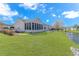 Backyard showcasing the lawn and the waterway that passes behind the homes at 619 Crestview Ct., Longs, SC 29568