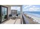 Relax on this charming balcony with ocean views and comfortable seating for two at 6200 N Ocean Blvd. # 501, North Myrtle Beach, SC 29582