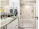 Modern bathroom with granite countertop and tiled shower at 6200 N Ocean Blvd. # 501, North Myrtle Beach, SC 29582