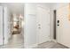 Inviting hallway with bright lighting, neutral paint, and a beautiful beach view at the end at 6200 N Ocean Blvd. # 501, North Myrtle Beach, SC 29582