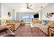 Bright living room with balcony access and vibrant decor at 6200 N Ocean Blvd. # 501, North Myrtle Beach, SC 29582