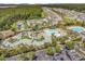 Aerial view of community pools, amenities, landscaping and neighborhood at 675 Pistoia Ln. # 675, Myrtle Beach, SC 29579