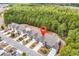 An aerial view of the townhome community with lush trees and a pin locating the subject property at 675 Pistoia Ln. # 675, Myrtle Beach, SC 29579