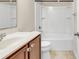 Clean bathroom with white tub, tile floor, modern sink with a vanity, and a mirrored wall at 675 Pistoia Ln. # 675, Myrtle Beach, SC 29579