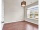 Cozy bedroom with hardwood floors, a modern light fixture, and a window overlooking neighborhood at 675 Pistoia Ln. # 675, Myrtle Beach, SC 29579