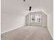 Bright bedroom with neutral carpet, ceiling fan, and large window overlooking the neighborhood at 675 Pistoia Ln. # 675, Myrtle Beach, SC 29579