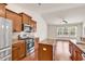 Open-concept kitchen with stainless steel appliances, granite countertops, and a seamless transition to the living area at 675 Pistoia Ln. # 675, Myrtle Beach, SC 29579