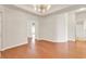 Spacious living room with hardwood floors and stylish light fixture at 675 Pistoia Ln. # 675, Myrtle Beach, SC 29579
