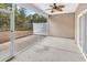 An outdoor screened patio with stained concrete flooring and a ceiling fan for comfortable outdoor living at 675 Pistoia Ln. # 675, Myrtle Beach, SC 29579