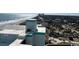Panoramic aerial view showcasing coastal homes, sandy beach, and lush greenery at 6804 N Ocean Blvd. # 1237, Myrtle Beach, SC 29572