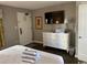 Bright bedroom featuring a TV, dresser, and comfortable bedding at 6804 N Ocean Blvd. # 1237, Myrtle Beach, SC 29572