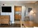 Living area with dining table and view into the kitchen with oak cabinets at 6804 N Ocean Blvd. # 1237, Myrtle Beach, SC 29572
