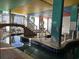 Unique indoor pool with a pedestrian bridge and colorful decor at 6804 N Ocean Blvd. # 1237, Myrtle Beach, SC 29572