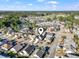 Stunning aerial view showcasing a neighborhood with tree lined streets, ponds, and many beautiful homes at 7377 Guinevere Circle, Myrtle Beach, SC 29588