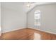 Bedroom with hardwood floors, an arched window and a ceiling fan at 7377 Guinevere Circle, Myrtle Beach, SC 29588