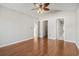 Spacious bedroom boasts wood floors, ceiling fan, and access to a walk-in closet and bathroom at 7377 Guinevere Circle, Myrtle Beach, SC 29588