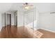 Spacious bedroom featuring wood floors, closet and ceiling fan offering an abundance of space at 7377 Guinevere Circle, Myrtle Beach, SC 29588