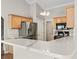 Open kitchen featuring a breakfast bar, light wood cabinets, stainless steel appliances and quartz countertops at 7377 Guinevere Circle, Myrtle Beach, SC 29588