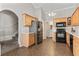 Spacious kitchen area with stainless steel refrigerator, black appliances and tile flooring throughout at 7377 Guinevere Circle, Myrtle Beach, SC 29588