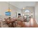 Bright living room showcasing a dining area, comfortable seating, and large windows for natural light at 7377 Guinevere Circle, Myrtle Beach, SC 29588