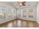 Bright sunroom filled with natural light from many windows and a decorative ceiling fan at 7377 Guinevere Circle, Myrtle Beach, SC 29588
