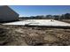 New home foundation featuring concrete slab with pipes and a view of the surrounding community at 899 Agostino Dr., Myrtle Beach, SC 29579