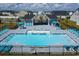 Community pool featuring ample lounge seating and a covered gazebo area to provide some refreshing shade at 899 Agostino Dr., Myrtle Beach, SC 29579