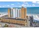 Aerial view of oceanfront property with parking garage, high-rise buildings and the ocean at 9550 Shore Dr. # 1511, Myrtle Beach, SC 29572